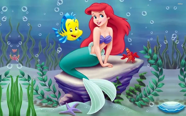 Ariel sits on a rock with Flounder and Sebastian