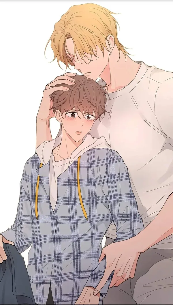 Blond man is hugging a crying, brown-haired boy