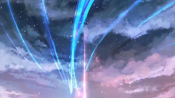 Blue and pink shooting stars streak across a starry night sky