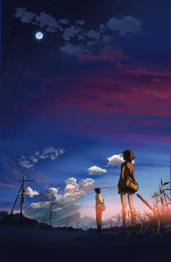 Boy and girl standing in a field at sunset