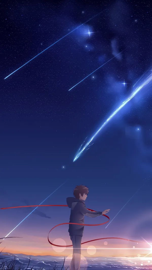 Boy reaching for a shooting star on a beautiful summer night
