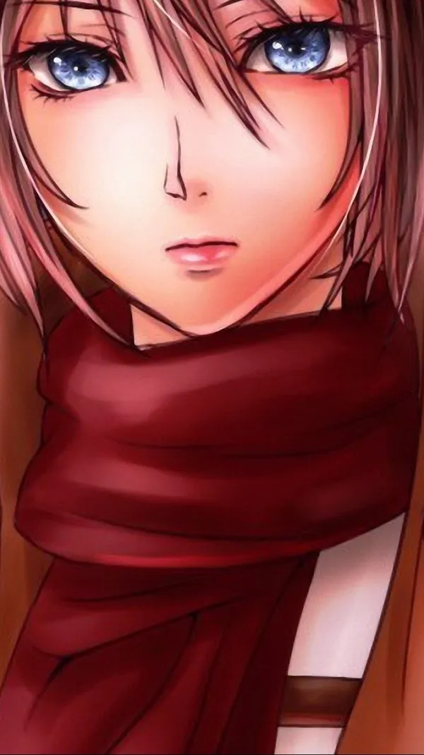 Close up of a young woman with blue eyes and a red scarf