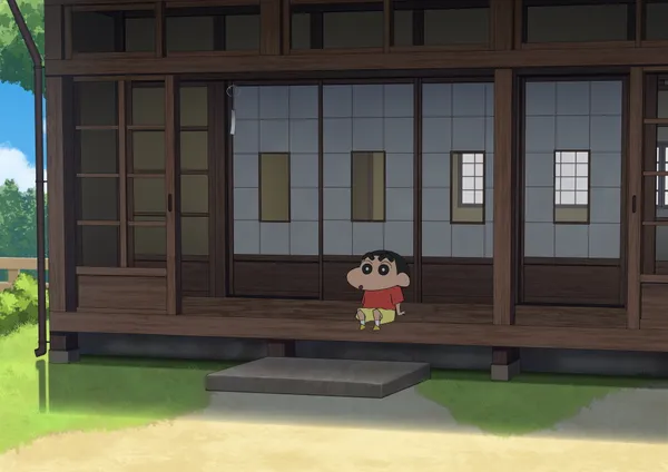 Crayon Shin-chan is sitting on the porch of a traditional Japanese house