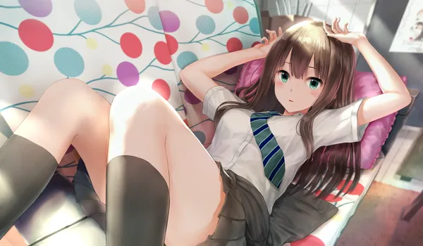 Girl in a school uniform is lying on a couch