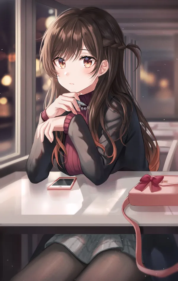 Girl is sitting at a table by a window. She is looking out the window