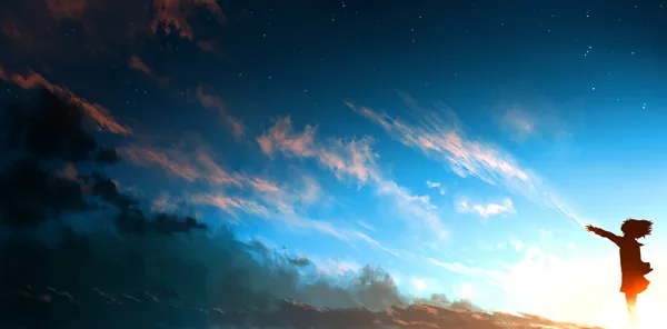 Girl standing with arms outstretched in front of a beautiful sunset