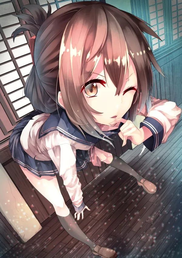 Girl with brown hair in a school uniform kneeling on the floor