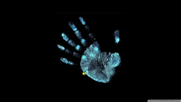 Glowing blue handprint on a black background
