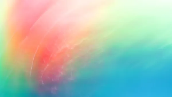 It's a blurred background with a gradient of pink, orange, green, and blue