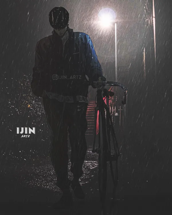 Man walking his bicycle in the rain at night