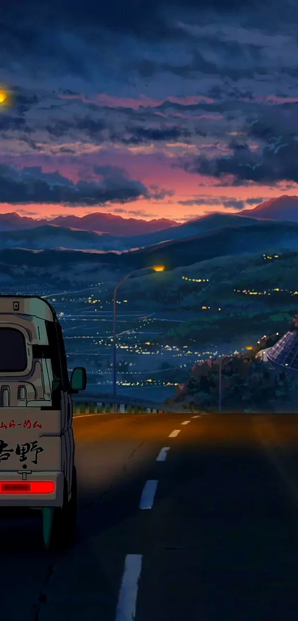 Vehicle traveling on a rural road at sunset