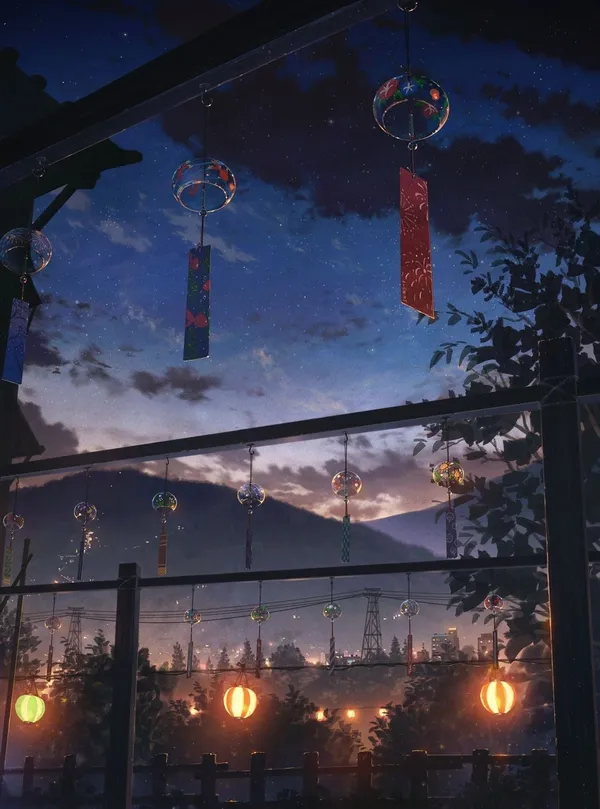 View of a city at night with paper lanterns and wind chimes