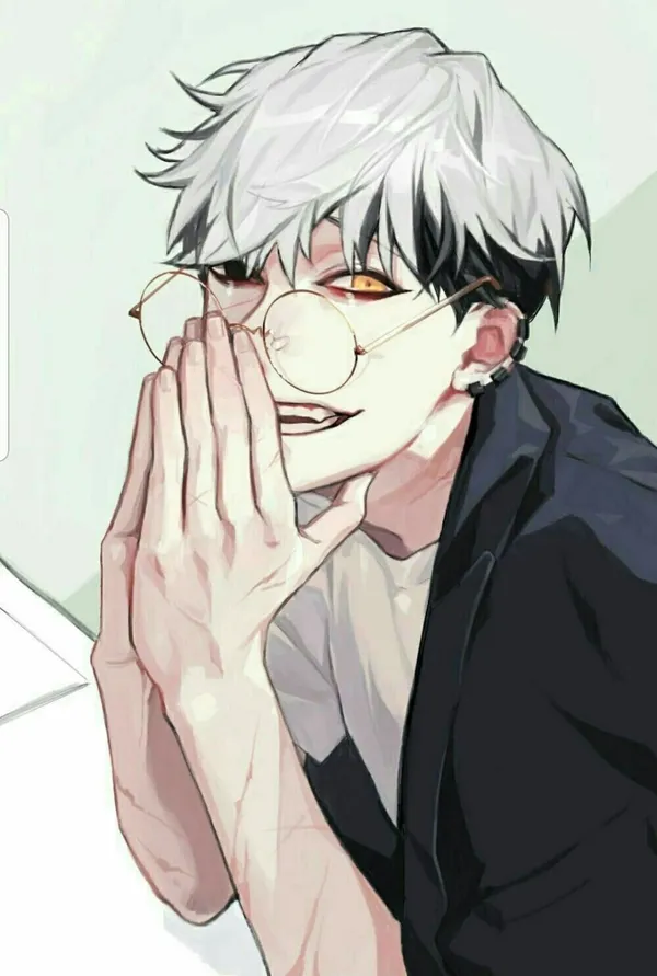 Young man with white hair and glasses is smiling